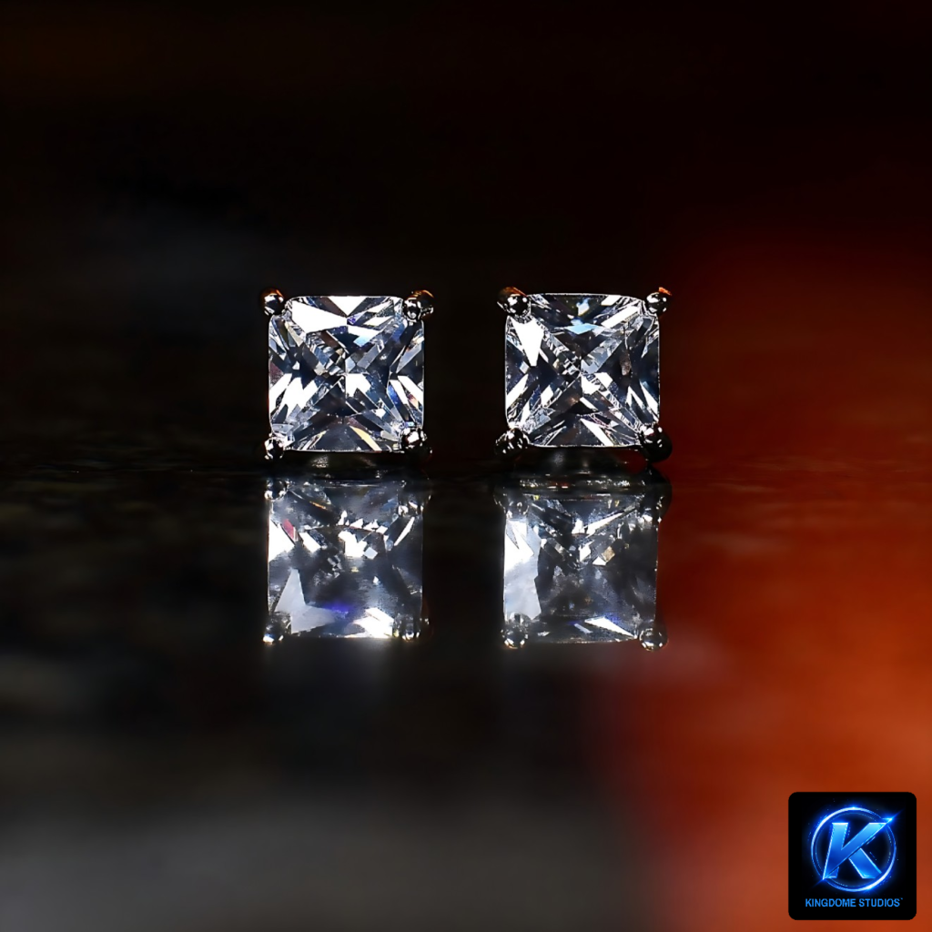 A pair of brilliant princess-cut diamond stud earrings on a reflective black surface. Best Website Photography and Videography Abbotsford BC by KingdomeStudios.com captures every detail