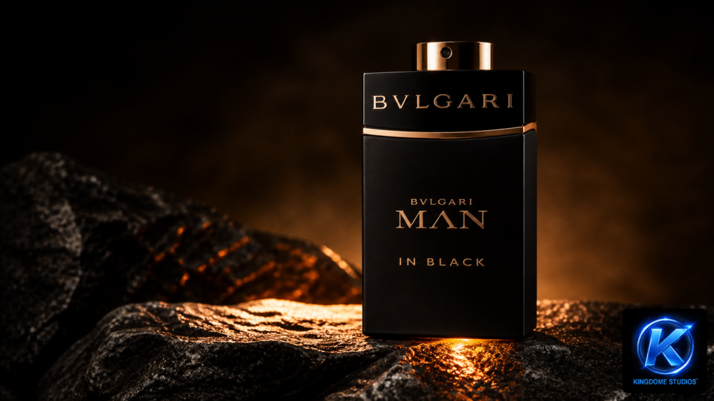Bold Bvlgari Man In Black fragrance bottle resting on rugged dark stone with amber lighting, shot by The Best Hero Product Image Photographer in Abbotsford BC for a high-end luxury feel
